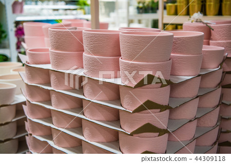 closeup of pink ceramics pots collection in store 44309118