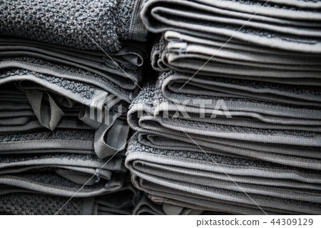 Natural pure linen towels, napkins on tablecloth. Small business. Pile of striped white grey linen 44309129