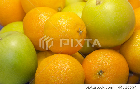 a lot of oranges and evil apples close up a lot of oranges and evil apples close up 44310554