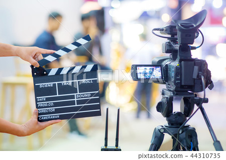 Man hands holding movie clapper 44310735