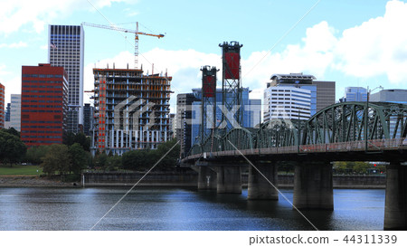 Portland, Oregon on a fine sunny day by a bridge Portland, Oregon on a fine sunny day by a bridge 44311339