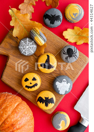 Halloween scary cookies with pumpkin on wooden cut board. pattern Bat , patina, ghosts and spiders Halloween scary cookies with pumpkin on wooden cut board. pattern Bat , patina, ghosts and spiders 44314627
