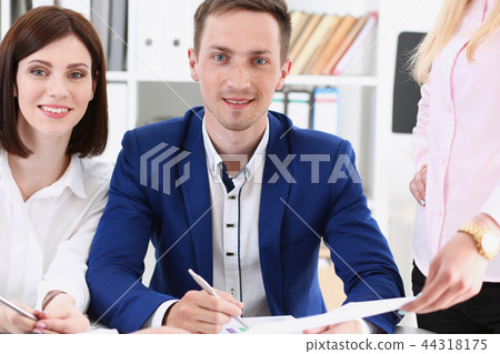 Group of people sit in office deliberate 44318175