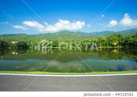 Along road landscape view Mountain blue sky 44318581