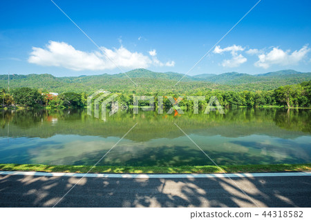 Along road landscape view Mountain blue sky 44318582