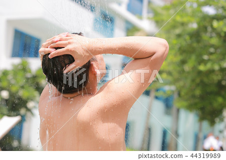 Portrait of a young man having a shower. Portrait of a young man having a shower. 44319989