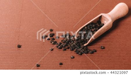 spicy pepper in a wooden bowl spicy pepper in a wooden bowl 44321097