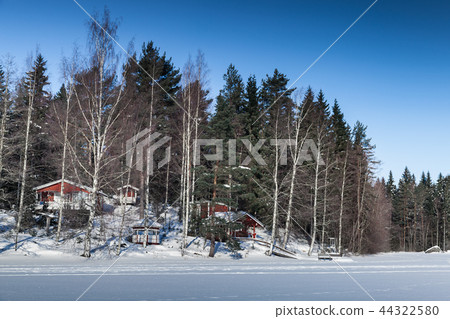 Rural winter landscape with red houses Rural winter landscape with red houses 44322580