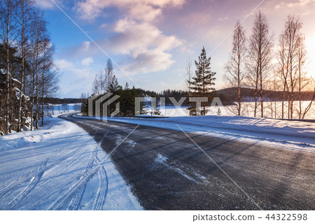 Empty rural road on a lake coast, winter Empty rural road on a lake coast, winter 44322598