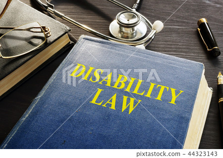 Disability Law book and stethoscope on a desk. 44323143