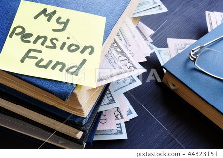 My pension fund. Books with dollar bills My pension fund. Books with dollar bills 44323151
