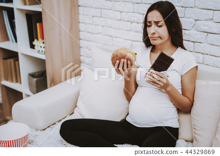 Home. Hungry. Grub. Pregnant Girl. Eat. Hamburger. 44329869