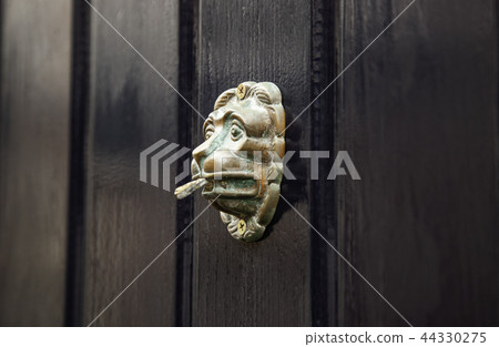Old metal door knocker Old metal door knocker 44330275