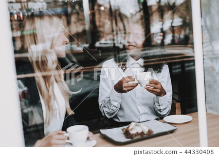 Blond Girl. Mulatto. Sit. Cafe. Drink Coffee. Blond Girl. Mulatto. Sit. Cafe. Drink Coffee. 44330408