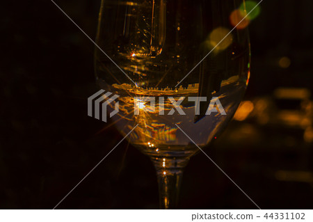 Sunset reflected in a wine glass Sunset reflected in a wine glass 44331102