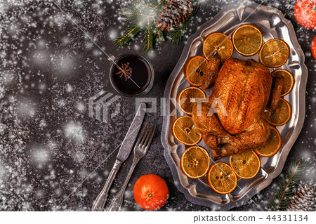 Roasted whole chicken with Christmas decoration. 44331134