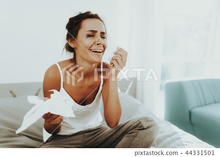 Sad Woman With Flowed Mascara Wipes The Tears. 44331501