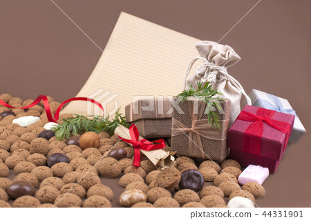 Dutch holiday Sinterklaas background with pepernoten.Traditional sweets and gifts for children for 44331901