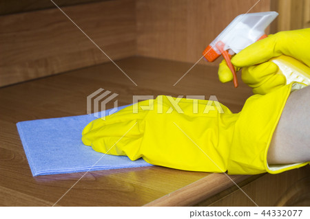 Cleaning the apartment, yellow gloves, dusting Cleaning the apartment, yellow gloves, dusting 44332077