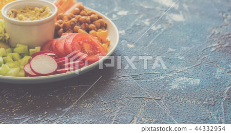 Healthy cut vegetables on the blue table Healthy cut vegetables on the blue table 44332954