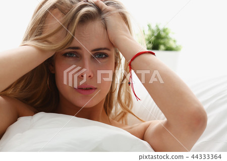 young woman is ill stay in bed have a headacke young woman is ill stay in bed have a headacke 44333364