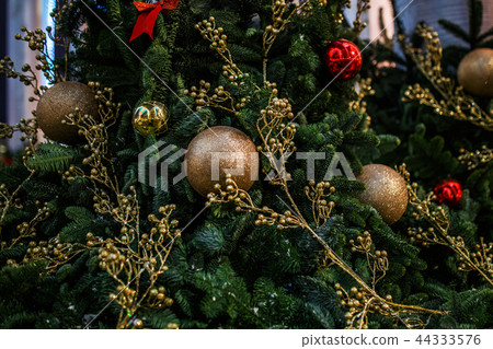 Decorated spruce branches swith balls, flowers, with burning lights 44333576