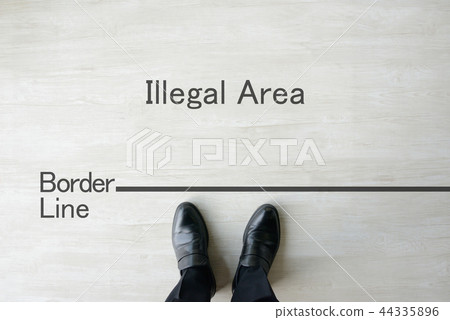 Businessman standing on borderline 44335896
