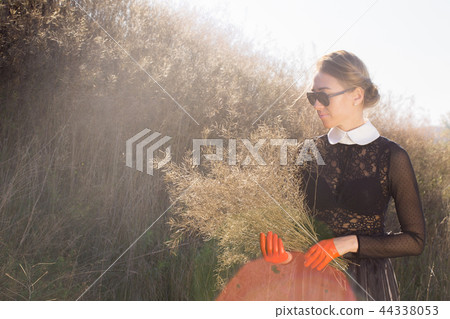 A woman hid behind a bouquet A woman hid behind a bouquet 44338053