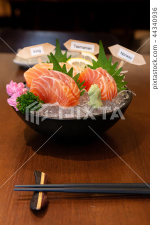 Japanese Salmon Sashimi, Chutoro, on ice in bowl. 44340936