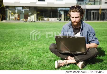 Bearded Man Working On The Street 44345052