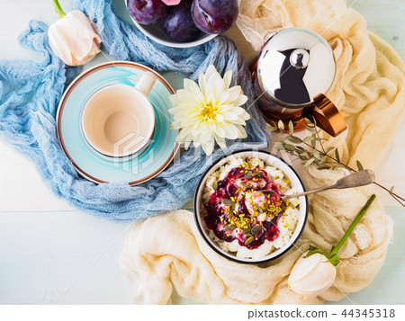 Breakfast with bowl of fresh quark, berries, seeds 44345318