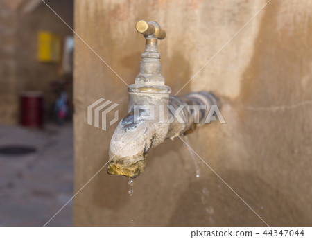 old faucet with lime deposit old faucet with lime deposit 44347044