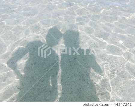 Silhouette floating in the sea 44347241