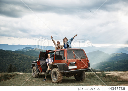 Lively young people travelling in their off-road vehicle 44347786