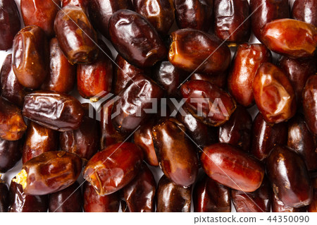 Fresh dates making a background pattern Fresh dates making a background pattern 44350090