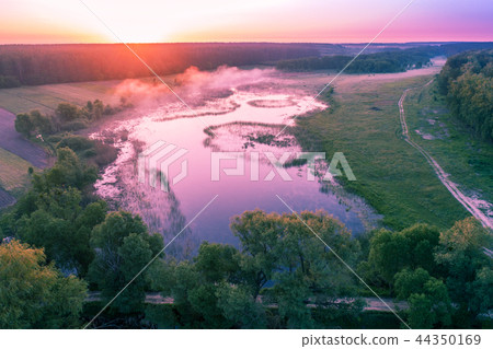 Aerial view of the countryside and river at dawn 44350169