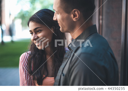 Close up of romantic couple standing and smiling 44350235