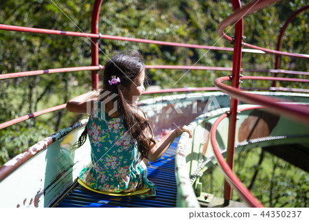 Girl playing on the slide Girl playing on the slide 44350237