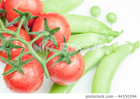 Fresh tomatoes and green peas Fresh tomatoes and green peas 44350394