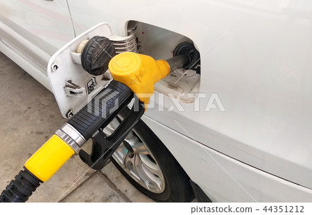 Yellow petrol nozzle used to pumping petrol Yellow petrol nozzle used to pumping petrol 44351212