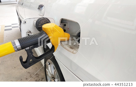 Yellow petrol nozzle used to pumping petrol Yellow petrol nozzle used to pumping petrol 44351213