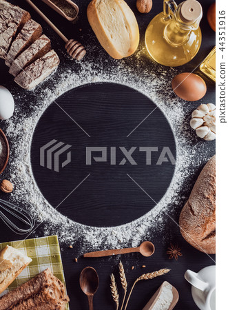 bread and bakery  ingredients on wood 44351916