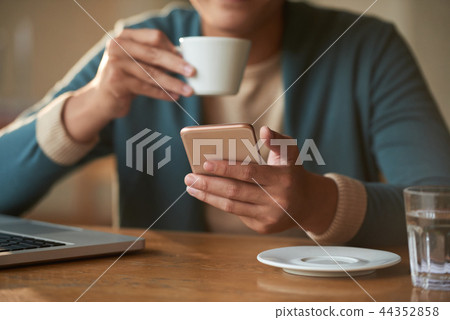 Man checking smartphone Man checking smartphone 44352858