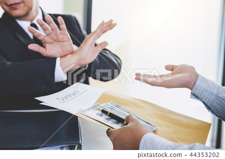 Bribery and corruption concept, senior businessman manager refus 44353202