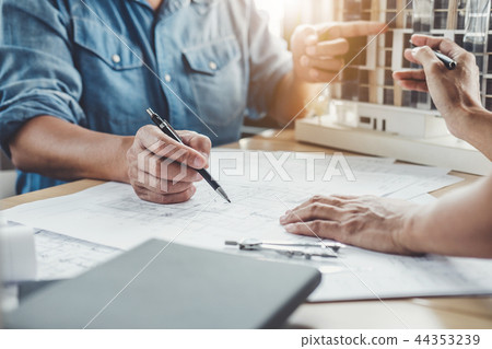 Hands of architect or engineer working on blueprint meeting for Hands of architect or engineer working on blueprint meeting for 44353239