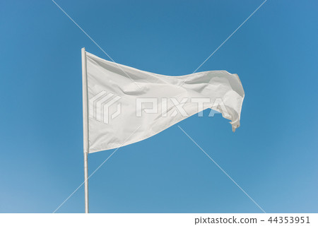 White flag against the blue sky 44353951