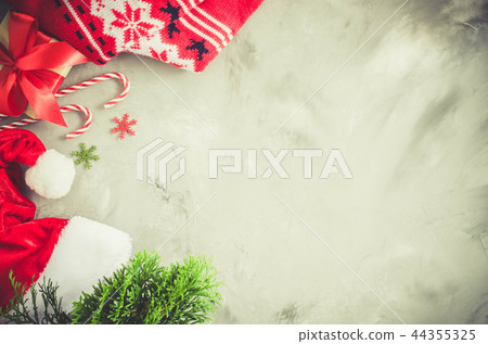 Christmas background. Santa's cap and decorations 44355325