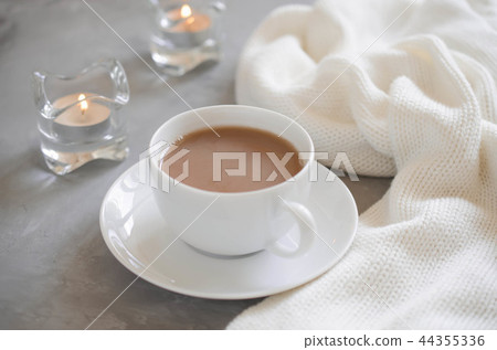 Cup of cocoa, candles and knited blanket. Cup of cocoa, candles and knited blanket. 44355336