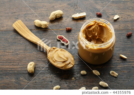 peanut butter in an open jar peanut butter in an open jar 44355976