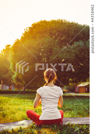 girl doing yoga outdoors girl doing yoga outdoors 44358462